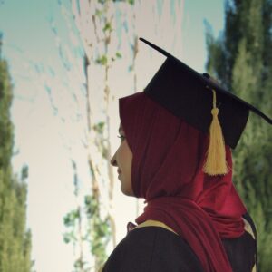 Woman in graduation cap.