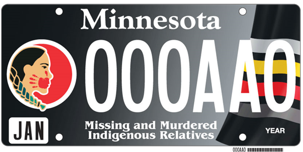 A Minnesota license plate designed to raise awareness about Missing and Murdered Indigenous Relatives. The plate features a profile of an Indigenous woman on the left with red and yellow detailing, symbolizing the urgency and importance of the issue. The background is a sleek black with the text "Minnesota" prominently displayed at the top and a specialized designation at the bottom stating "Missing and Murdered Indigenous Relatives." The license plate numbers are shown as "0000AA0" in a demonstration format.